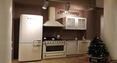 Smeg official store showroom with cream-colored appliances and Smeg logo